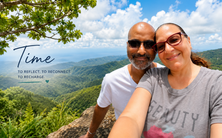 Couple enjoying a mountain view in Puerto Rico, illustrating how rest and a supportive environment create capacity for growth.